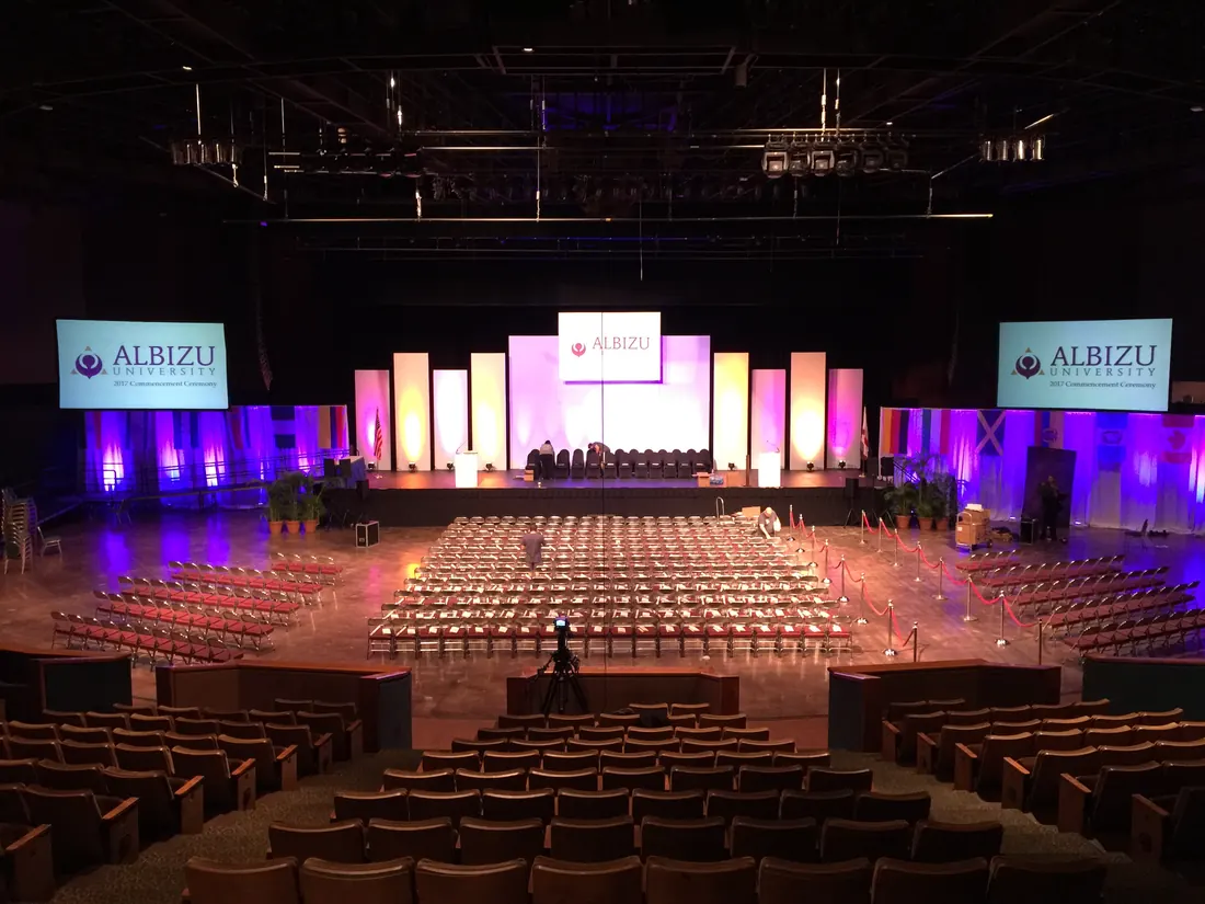 Graduation stage with screens and lighting at the James L. Knight Center